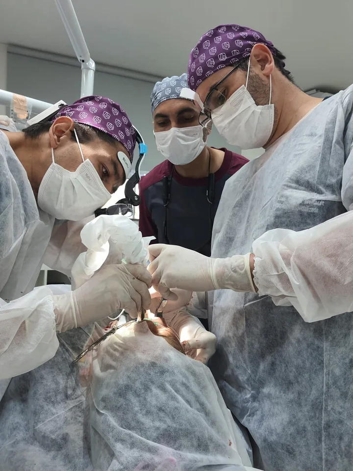 Dental surgeons participating in advanced hands-on clinical training.