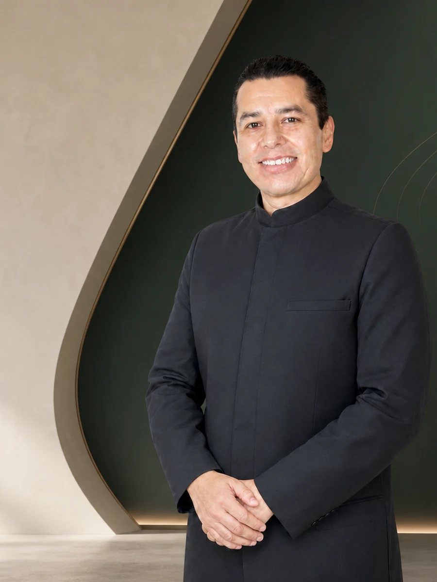 Portrait of Dr. Israel Ramos in a refined editorial setting.